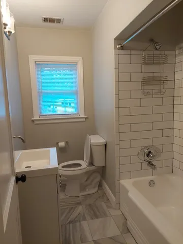 a bathroom with a sink and bathtub