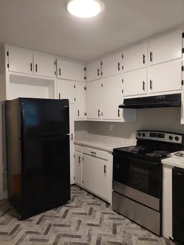 a kitchen with a sink and a stove