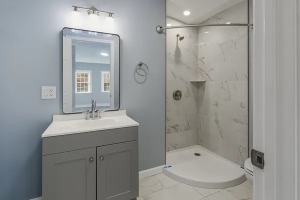 a view of hallway with wooden floor
