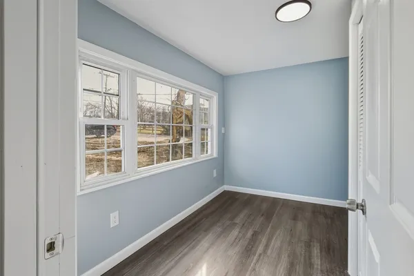 a view of entryway with wooden floor