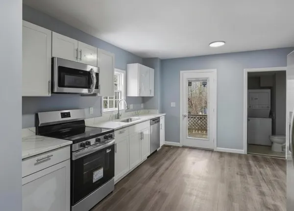 a bedroom with a bed and a table in it