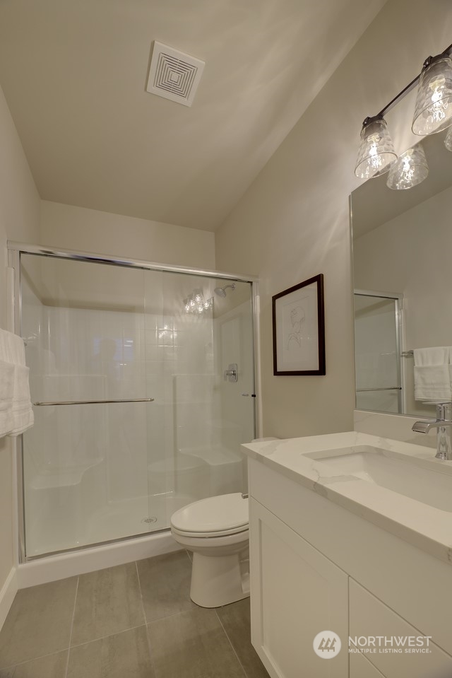 20210 94th Drive Northeast Bothell, WA 98011 - Photo 14 of 30 a bathroom with a shower a sink and toilet