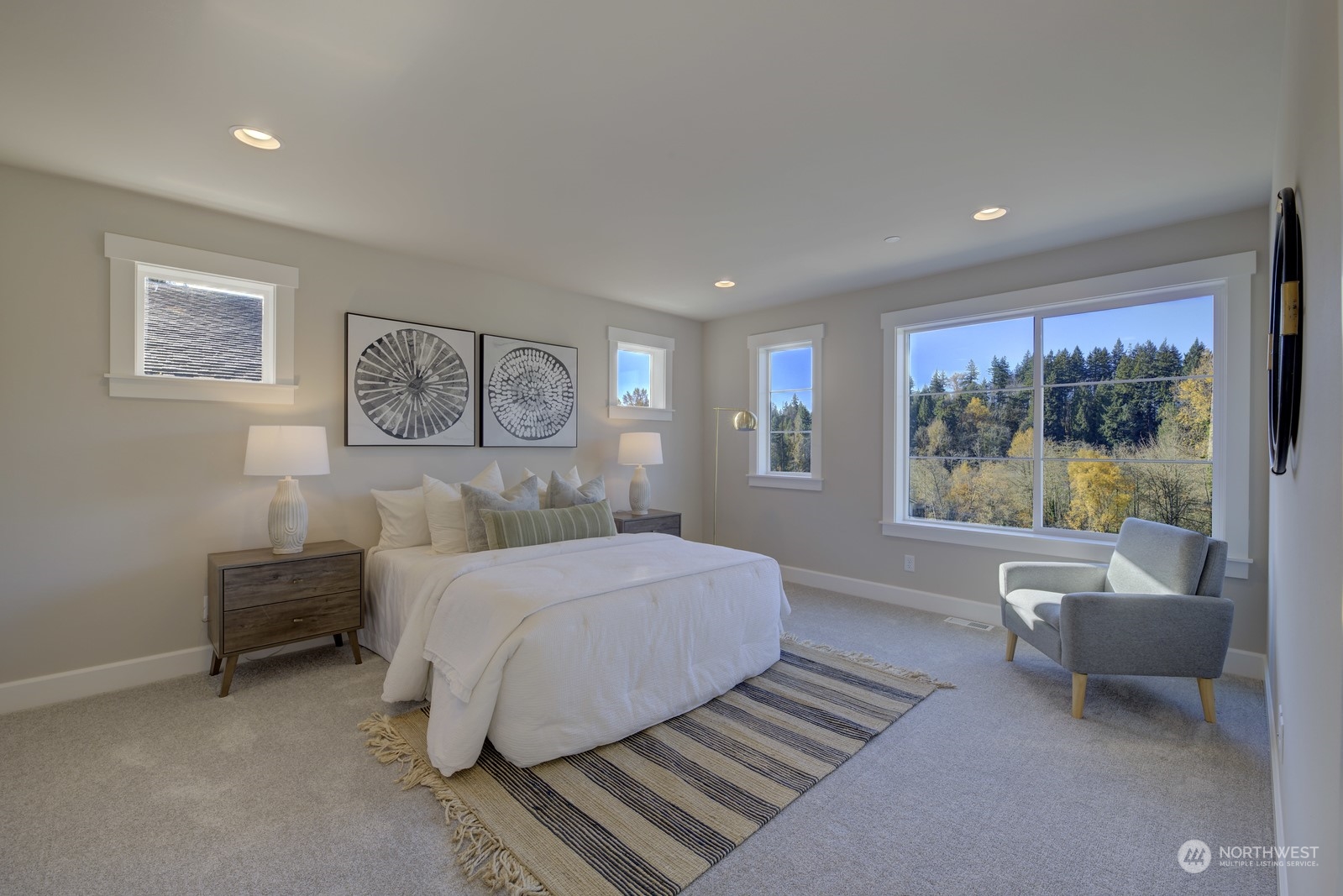 20210 94th Drive Northeast Bothell, WA 98011 - Photo 16 of 30 a spacious bedroom with a large bed and a couch