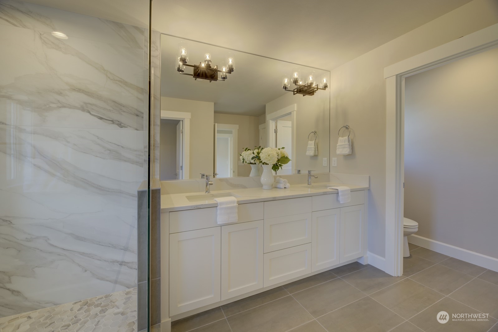 20210 94th Drive Northeast Bothell, WA 98011 - Photo 19 of 30 a bathroom with a double vanity sink mirror and shower
