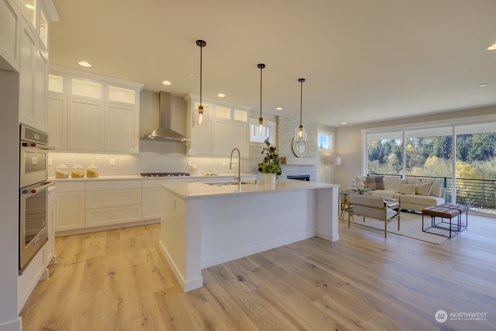 20210 94th Drive Northeast Bothell, WA 98011 - Photo 2 of 30 a kitchen with stainless steel appliances granite countertop a stove a sink and a wooden floors
