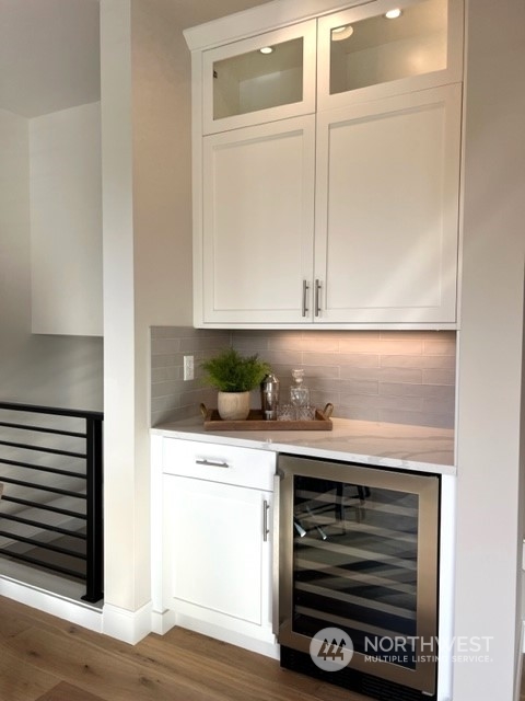 20210 94th Drive Northeast Bothell, WA 98011 - Photo 7 of 30 a kitchen with granite countertop a stove and a microwave