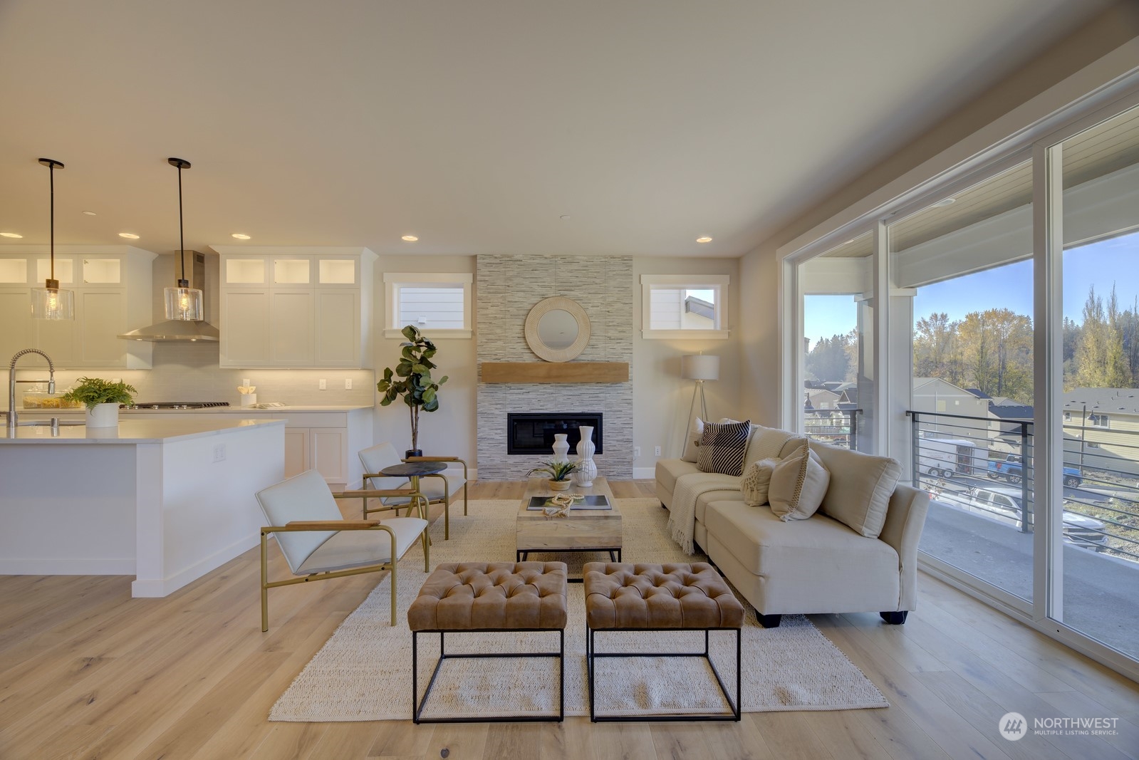 20210 94th Drive Northeast Bothell, WA 98011 - Photo 8 of 30 a living room with furniture a fireplace and a chandelier