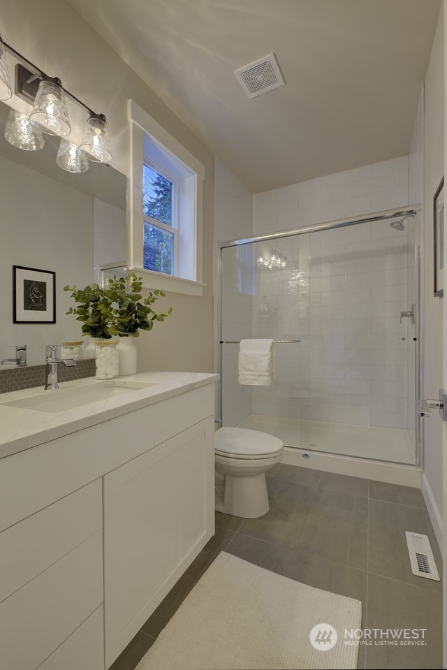 20210 94th Drive Northeast Bothell, WA 98011 - Photo 10 of 30 a bathroom with a sink a toilet and shower