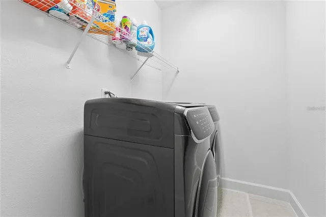 a view of a house with swimming pool and sitting area