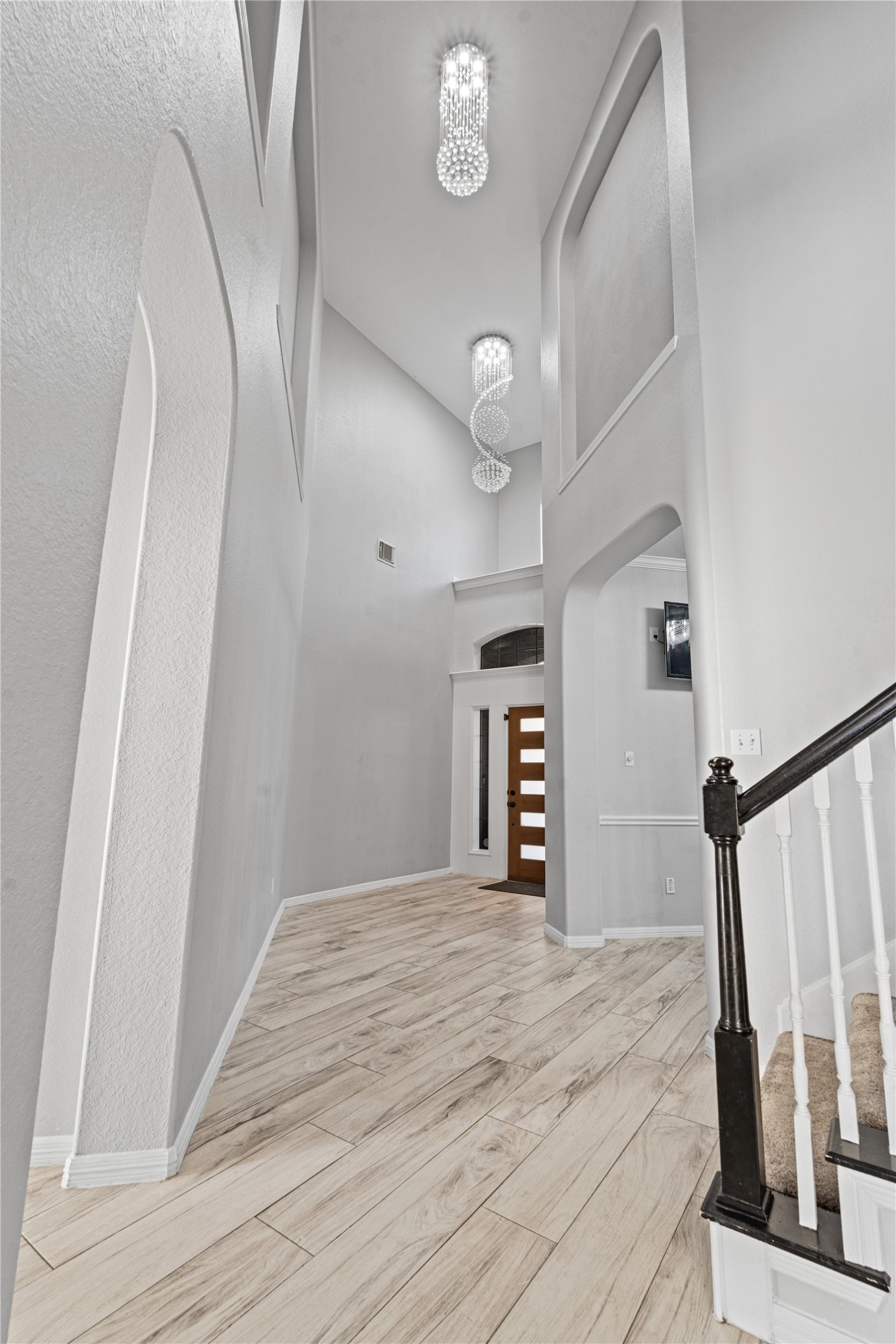 8111 Placid Point Court Humble, TX 77396 - Photo 3 of 35 Grand Foyer w/Upgraded Light Fixtures