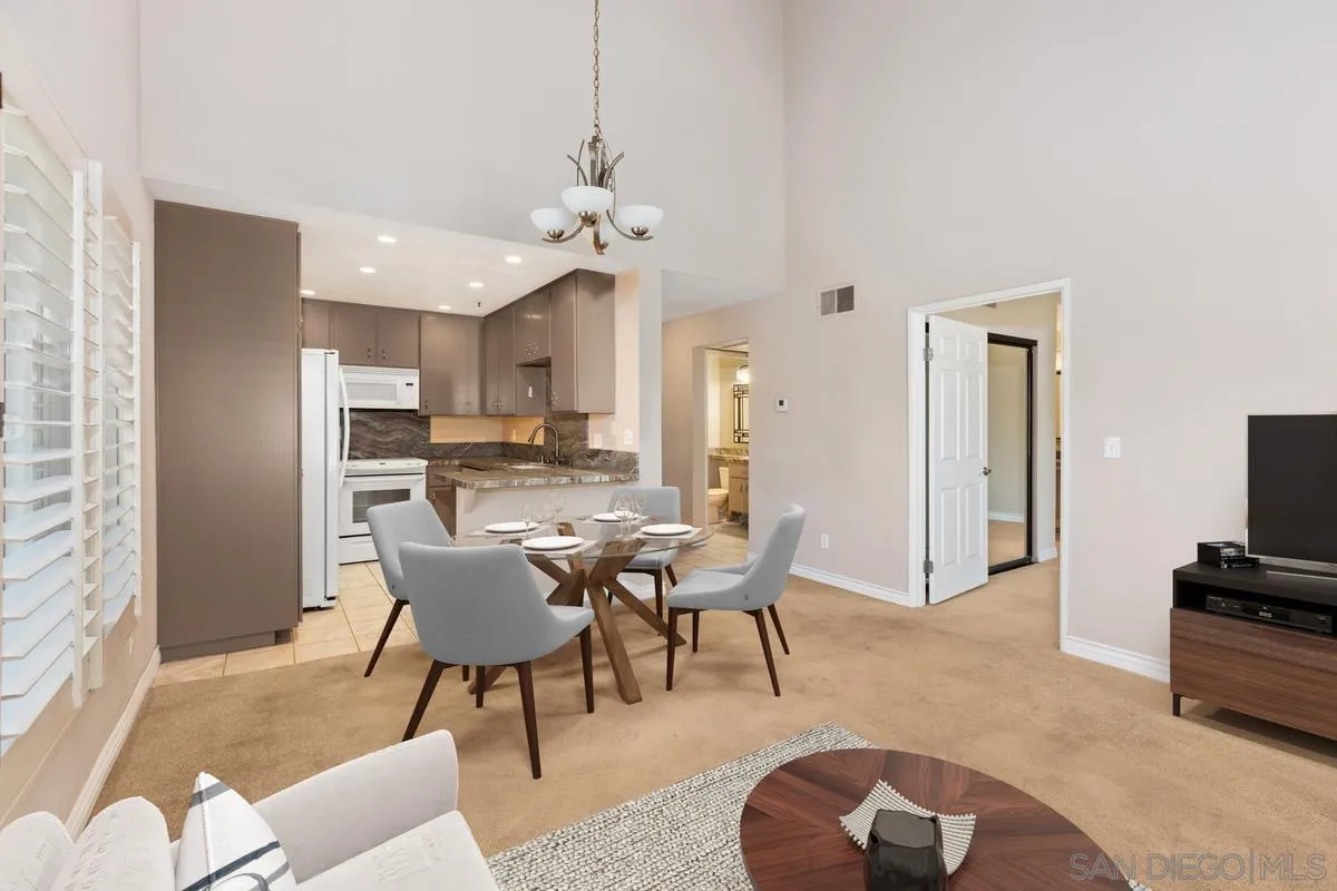 a view of a livingroom with furniture and a flat screen tv