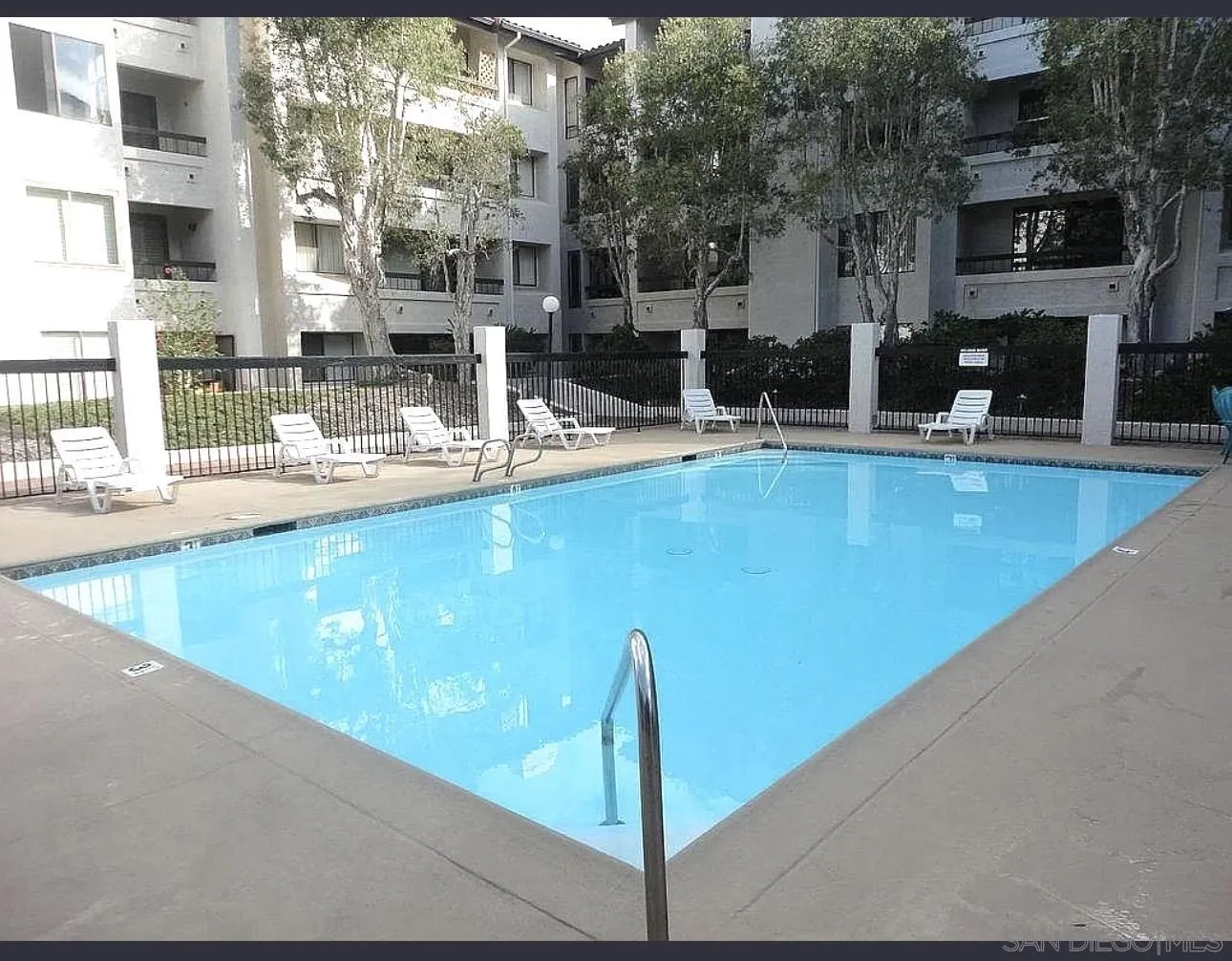 5645 Friars Road, Unit 397 San Diego, CA 92110 - Photo 13 of 22 a view of a living room with a floor to ceiling window and kitchen