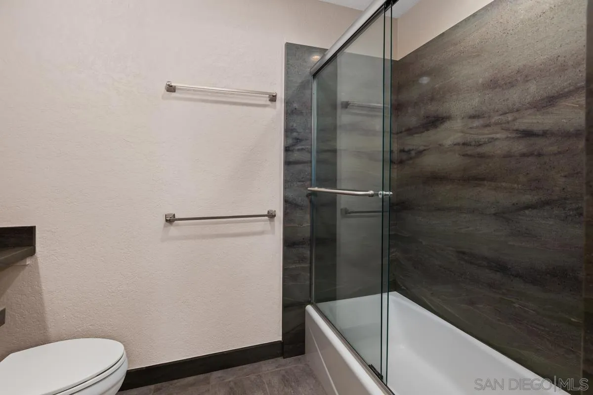 5645 Friars Road, Unit 397 San Diego, CA 92110 - Photo 8 of 22 a bathroom with a shower and toilet