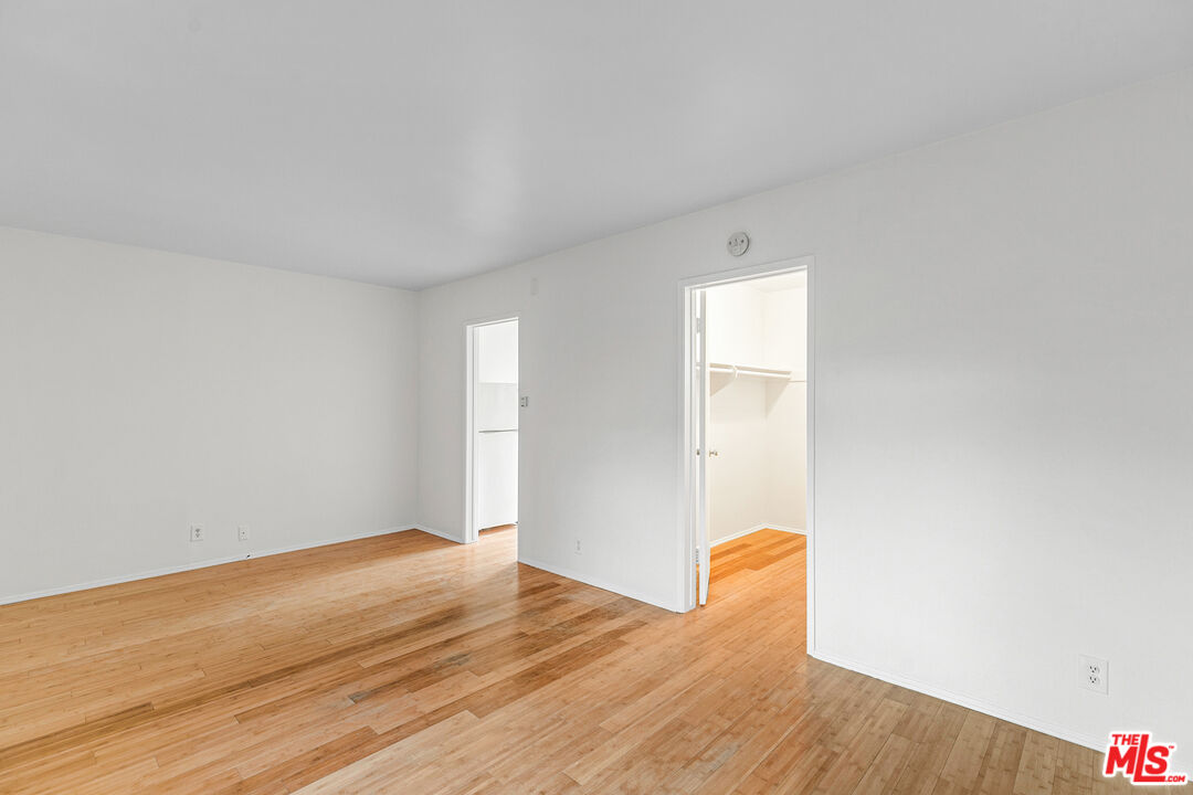 2637 South Centinela Avenue, Unit 13 Santa Monica, CA 90405 - Photo 8 of 15 a view of an empty room with wooden floor