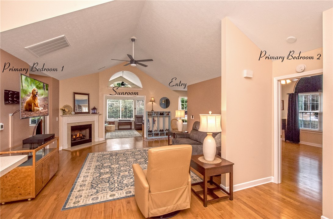 113 Life Style Lane Anderson, SC 29621 - Photo 13 of 28 This living area features a warm fireplace and bright sunroom access.