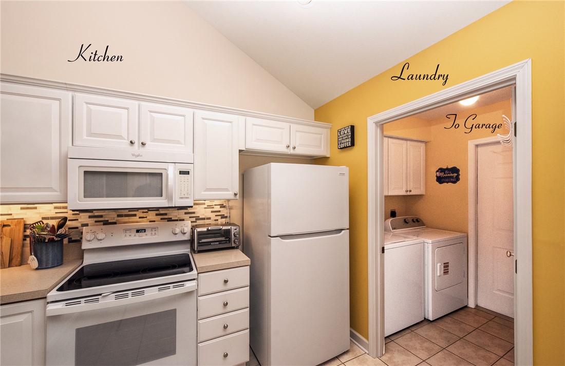 113 Life Style Lane Anderson, SC 29621 - Photo 15 of 28 This functional kitchen and adjacent laundry area offer everyday convenience and practical living spaces.