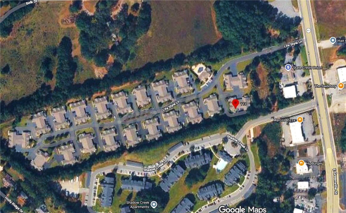 113 Life Style Lane Anderson, SC 29621 - Photo 27 of 28 An aerial perspective showcases a residential neighborhood and surrounding landscape.