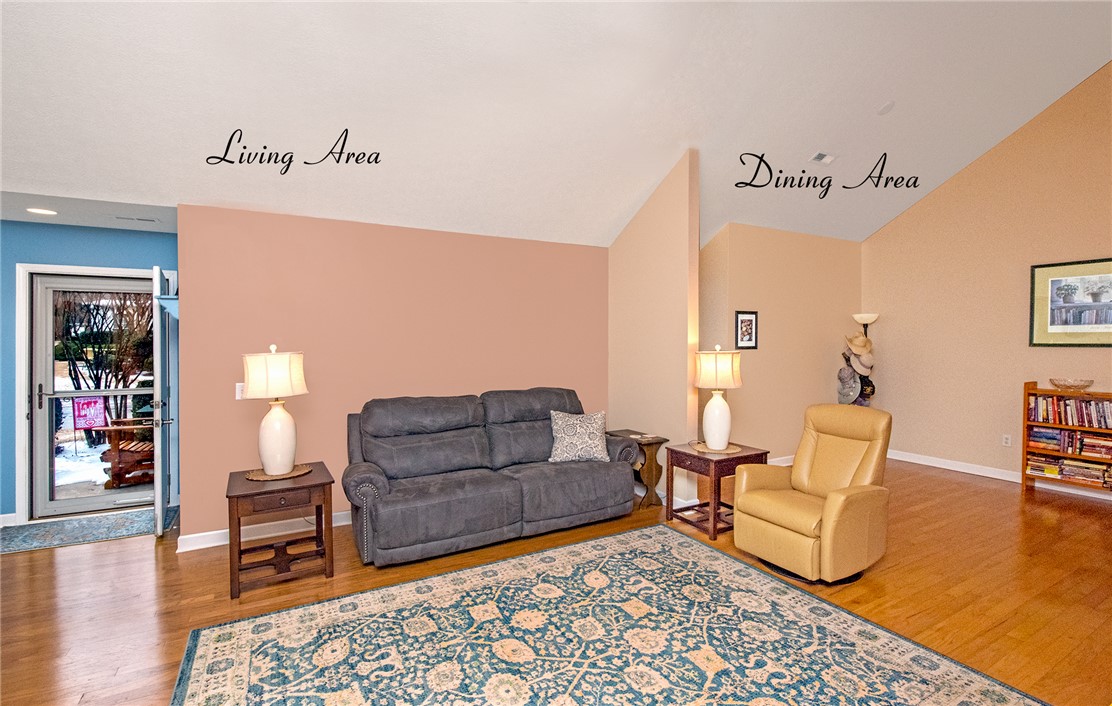 113 Life Style Lane Anderson, SC 29621 - Photo 4 of 28 This inviting living area boasts vaulted ceilings and rich hardwood flooring, creating an expansive atmosphere.