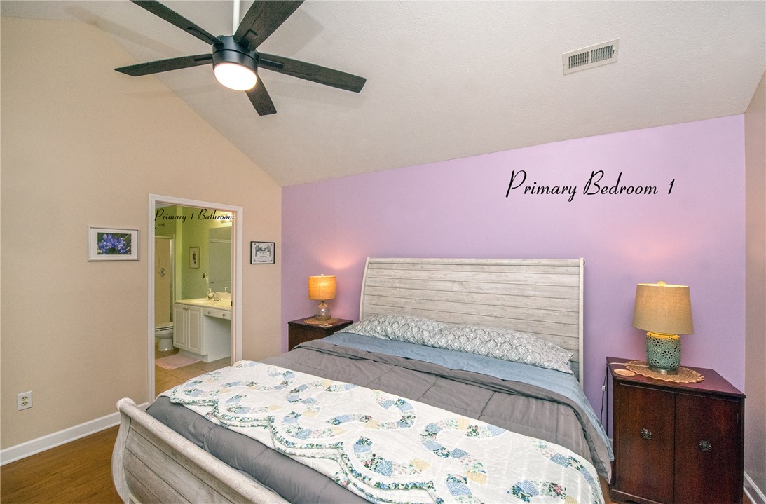 113 Life Style Lane Anderson, SC 29621 - Photo 8 of 28 This cozy bedroom features sloped ceilings and durable flooring, with convenient access to an en-suite bathroom.