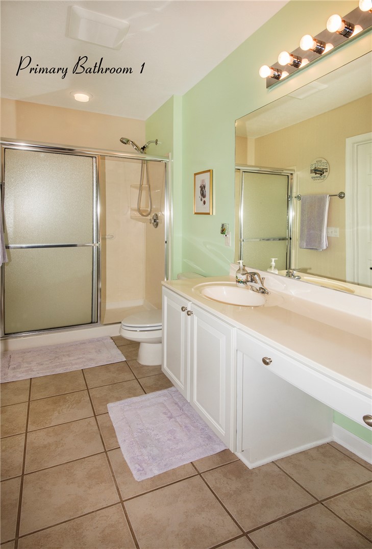 113 Life Style Lane Anderson, SC 29621 - Photo 10 of 28 This bathroom features a shower, a vanity with a sink, and tiled flooring.