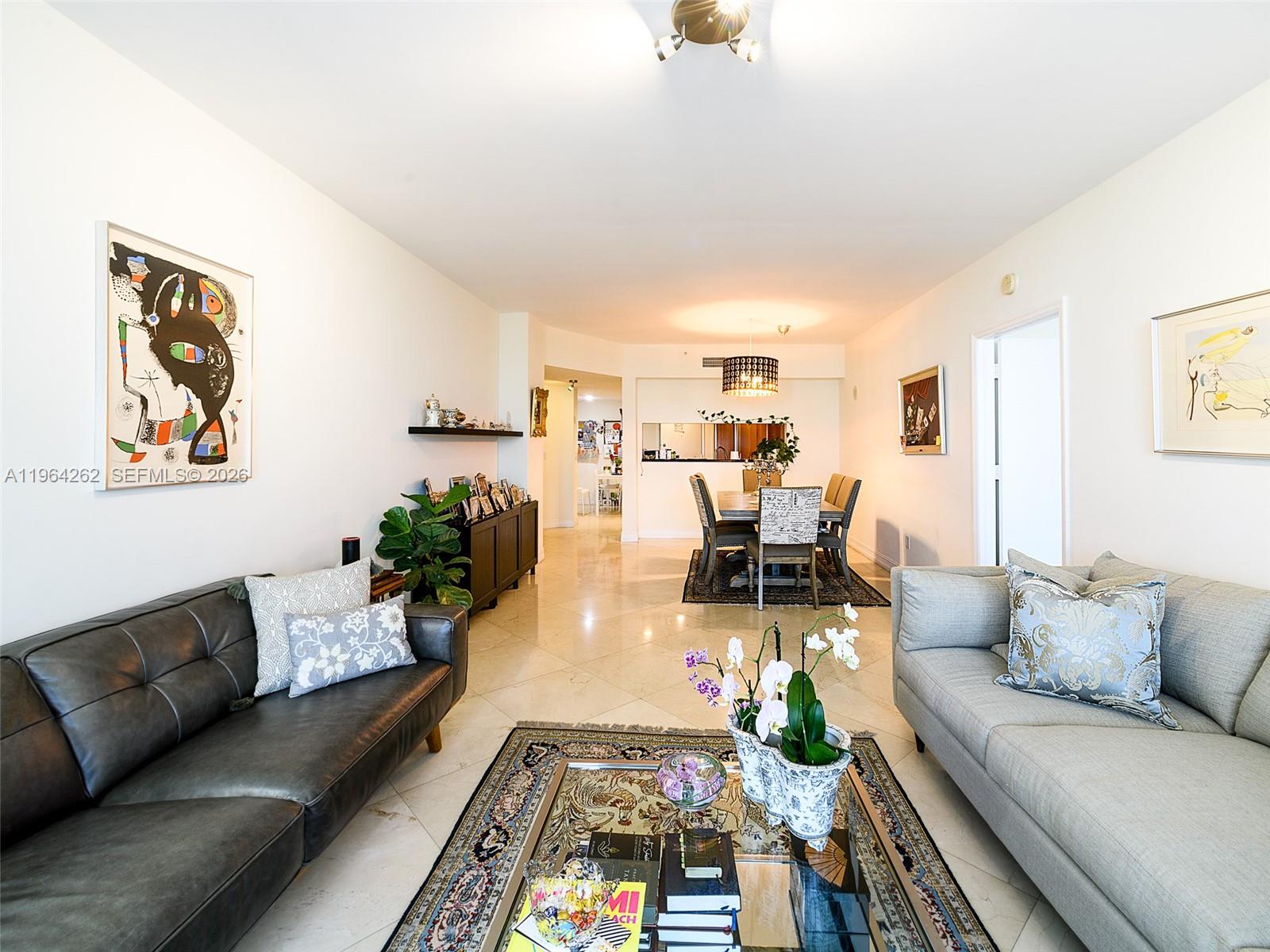 a living room with furniture and a table