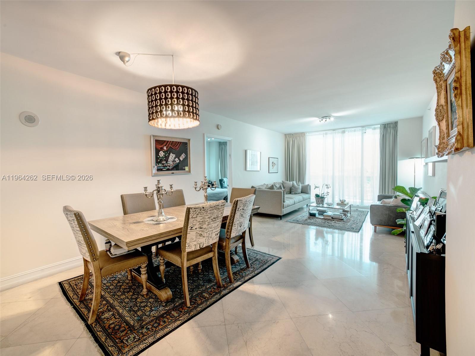 9595 Collins Avenue, Unit N5G Surfside, FL 33154 - Photo 3 of 12 a view of a dining room with furniture