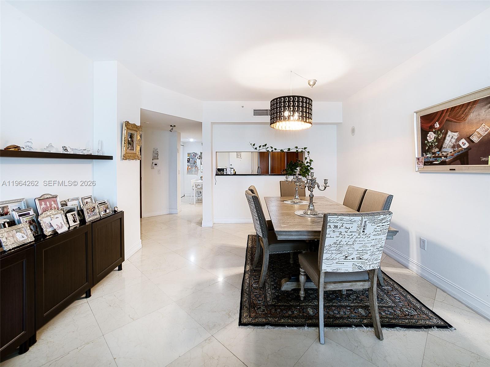 9595 Collins Avenue, Unit N5G Surfside, FL 33154 - Photo 4 of 12 a view of a dining room with furniture