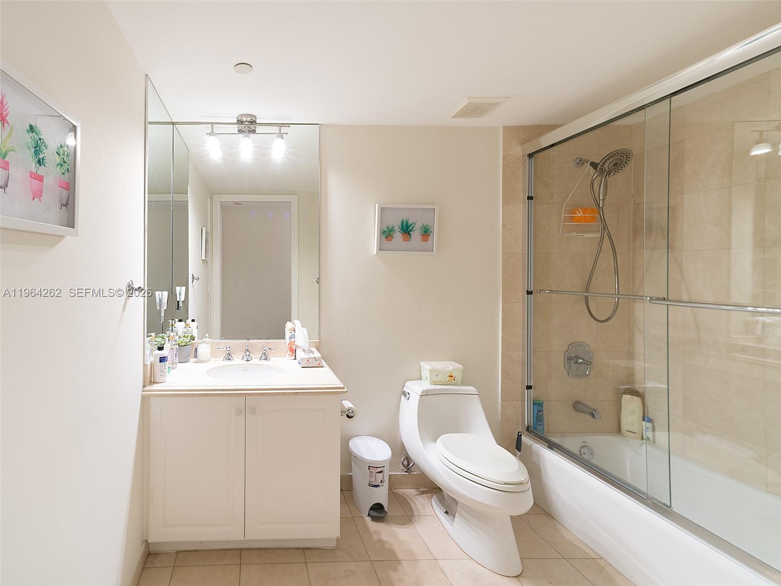 9595 Collins Avenue, Unit N5G Surfside, FL 33154 - Photo 9 of 12 a bathroom with a sink toilet and shower