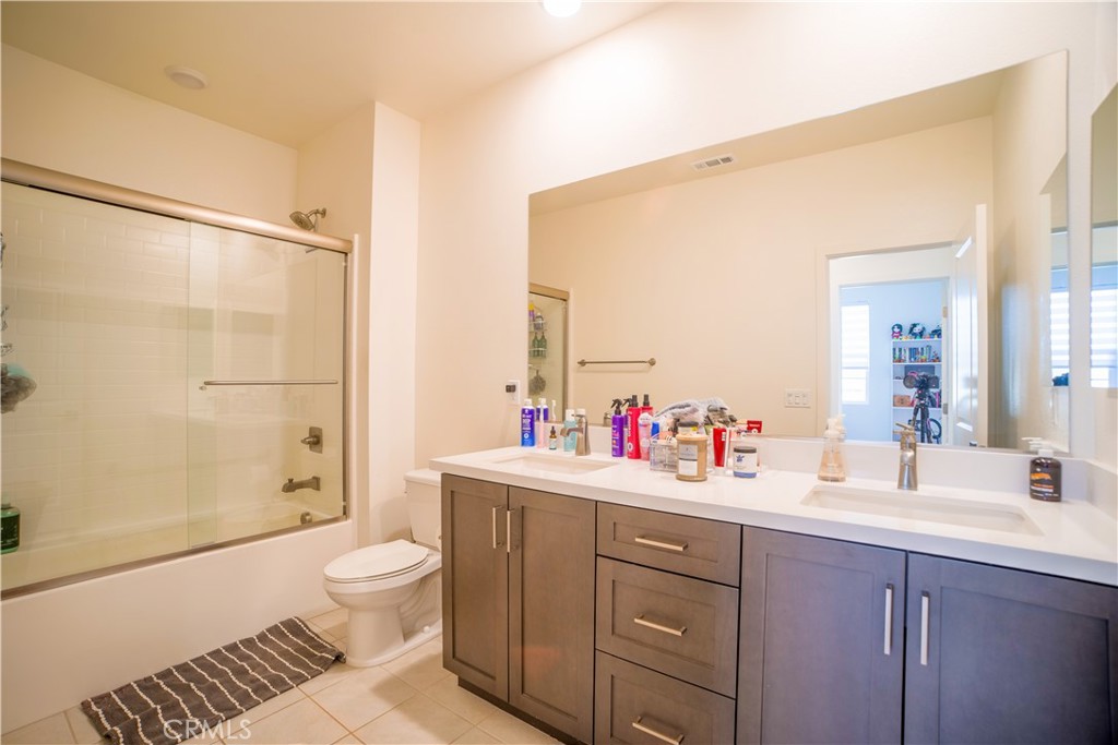35323 Orchard Trail Fallbrook, CA 92028 - Photo 18 of 30 a bathroom with a sink toilet vanity and shower