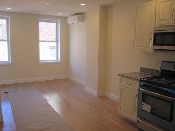 6 Baldwin Place Boston, MA 02113 - Photo 2 of 7 a kitchen with a stove and a microwave