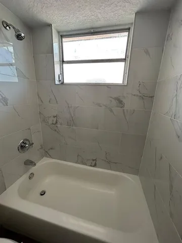 a bathroom with a bathtub