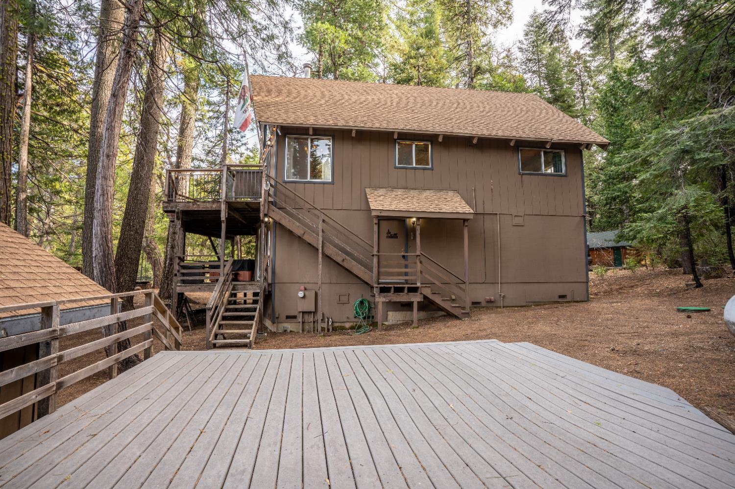 3790 Apache Road Arnold, CA 95223 - Photo 27 of 41 a view of a house with a patio and backyard