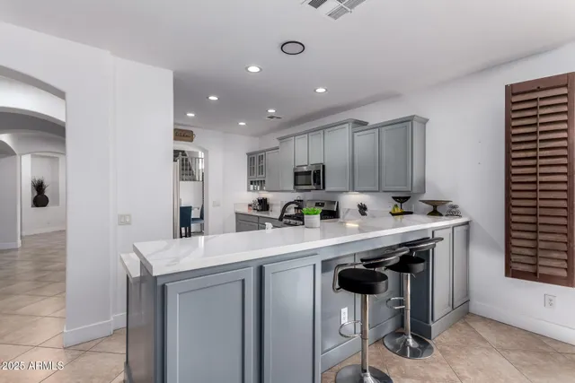 a kitchen with a sink and a refrigerator