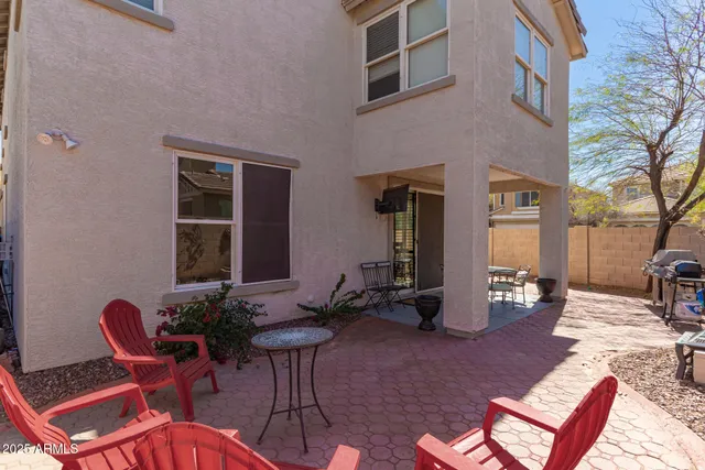 a patio with table and chairs