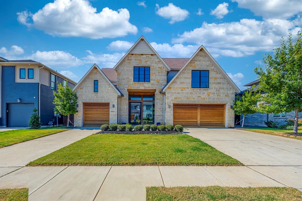 2081 Holt Way Grapevine, TX 76051 - Photo 2 of 40 a front view of a house with a yard and garage