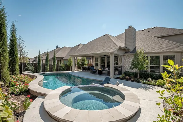 a view of a house with swimming pool and porch