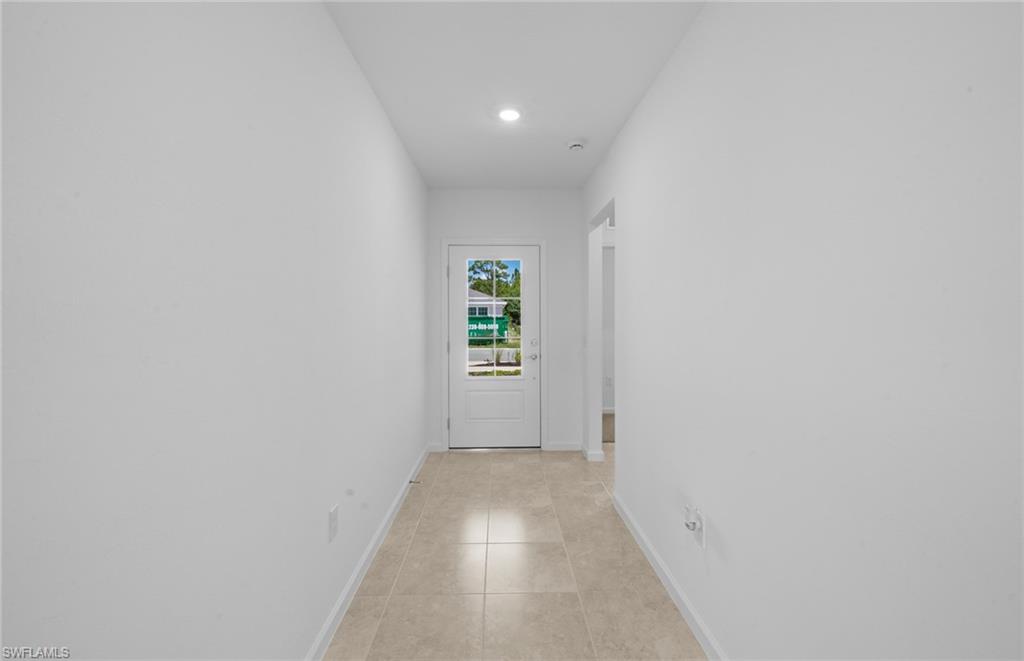 15828 Northridge Road Punta Gorda, FL 33982 - Photo 14 of 44 a view of an empty room with a window