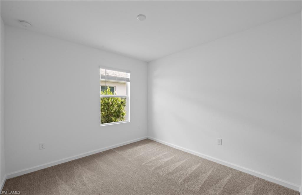 15828 Northridge Road Punta Gorda, FL 33982 - Photo 17 of 44 a view of an empty room and window