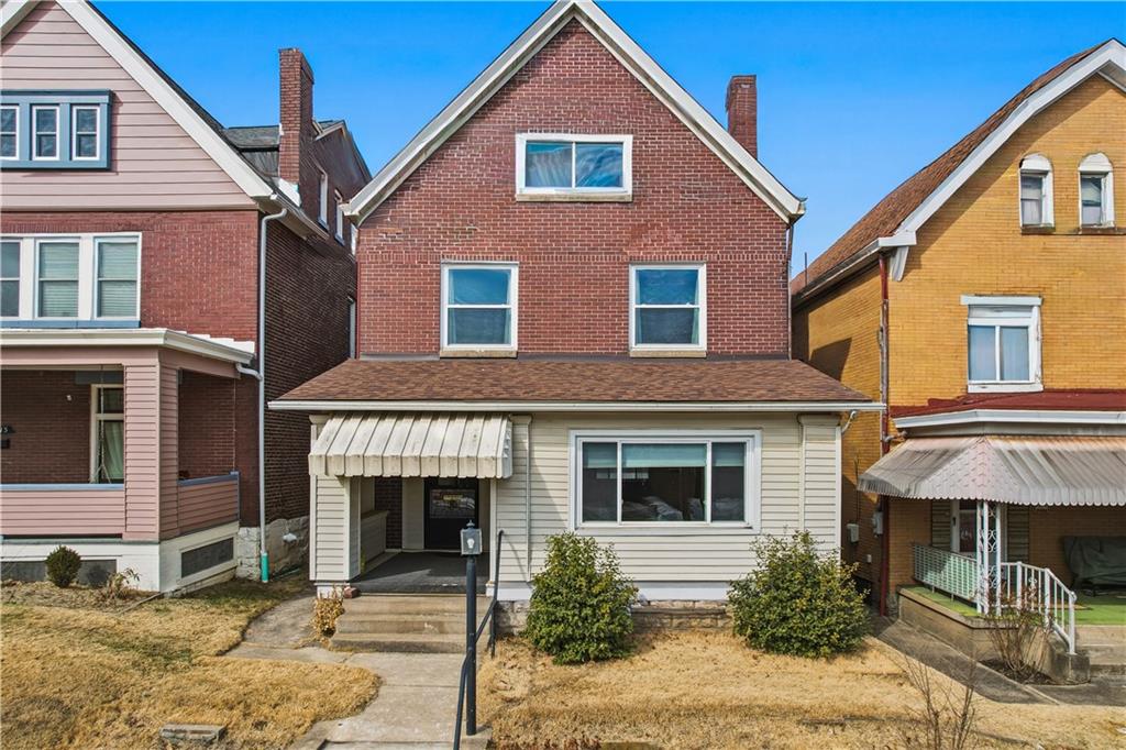 7215 Whipple Street Pittsburgh, PA 15218 - Photo 1 of 46 a front view of a house with garden