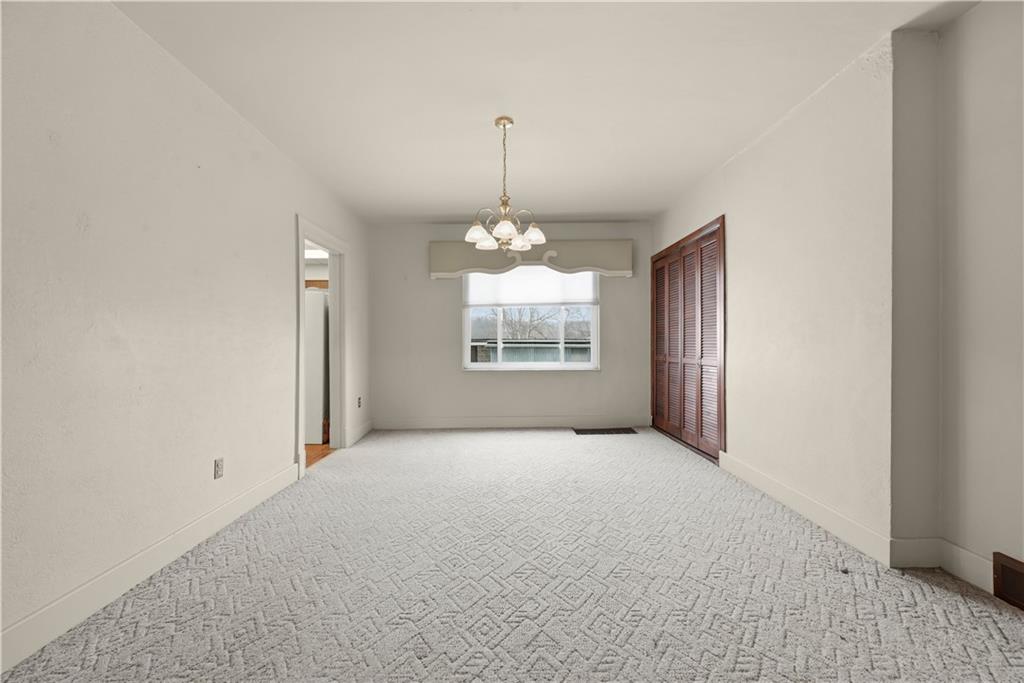 7215 Whipple Street Pittsburgh, PA 15218 - Photo 12 of 46 an empty room with windows and fireplace
