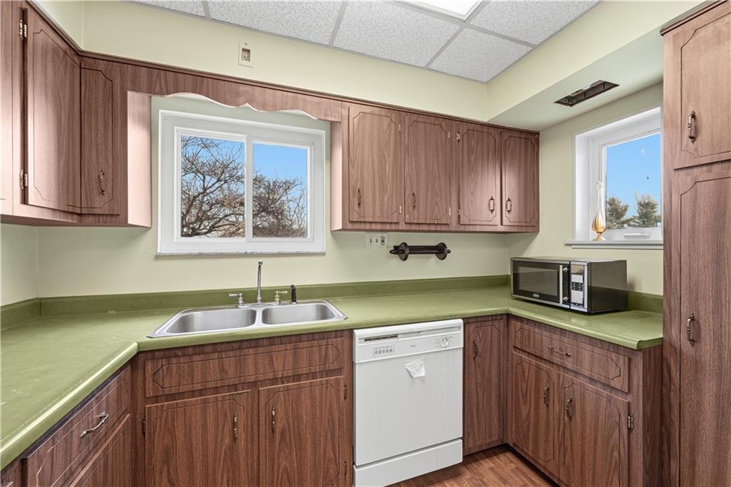 7215 Whipple Street Pittsburgh, PA 15218 - Photo 18 of 46 a kitchen with a sink cabinets and window