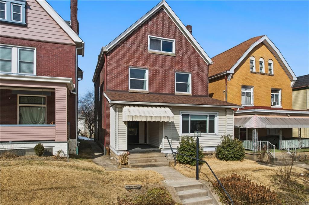7215 Whipple Street Pittsburgh, PA 15218 - Photo 2 of 46 a front view of a house with yard