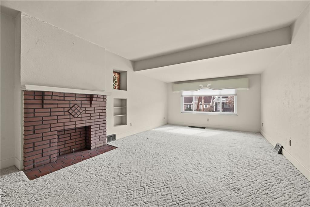 7215 Whipple Street Pittsburgh, PA 15218 - Photo 8 of 46 a view of an empty room and fire place