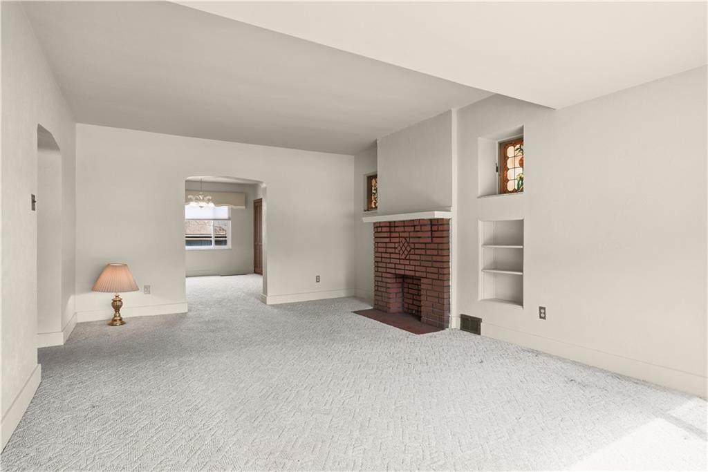 7215 Whipple Street Pittsburgh, PA 15218 - Photo 10 of 46 an empty room with windows and fireplace