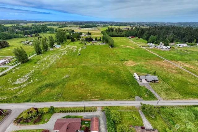a view of a yard with an outdoor seating