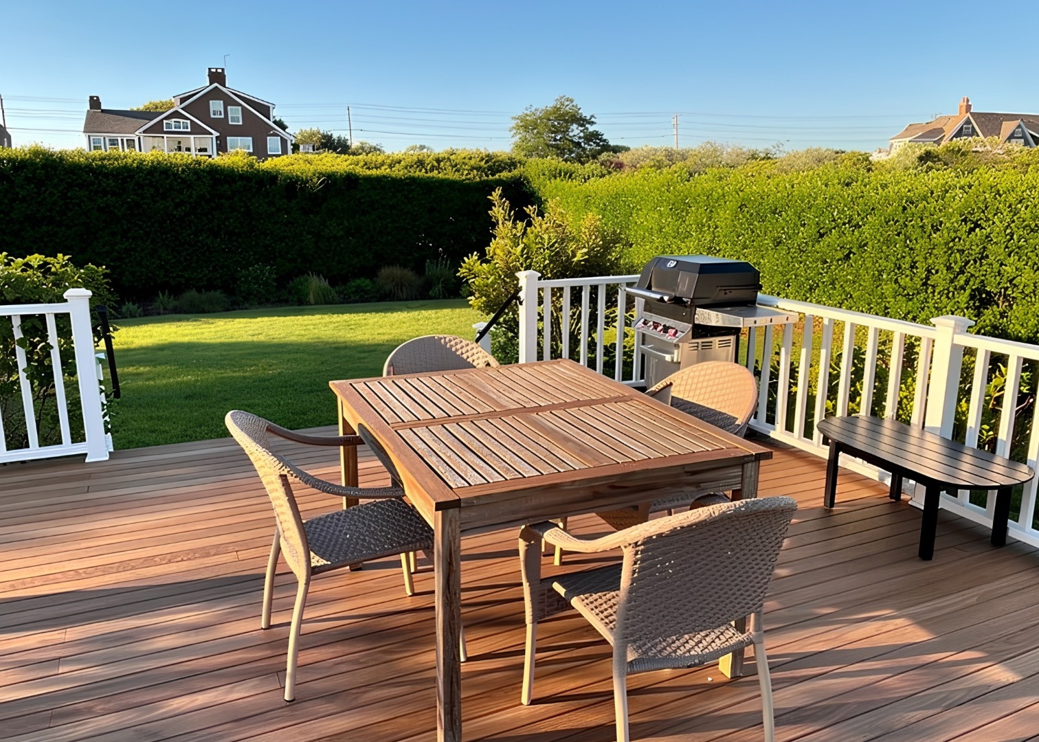 78 Baxter Road Nantucket, MA 02554 - Photo 9 of 14 a view of a patio with table and chairs with wooden floor and fence