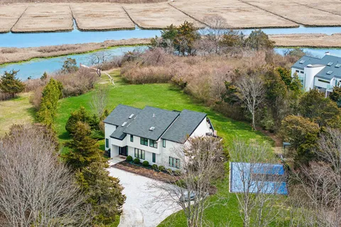 an aerial view of a house with a garden