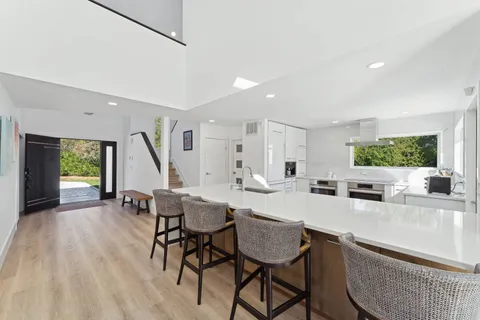 a view of a dining room with furniture and window