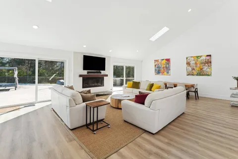 a living room with furniture and a rug