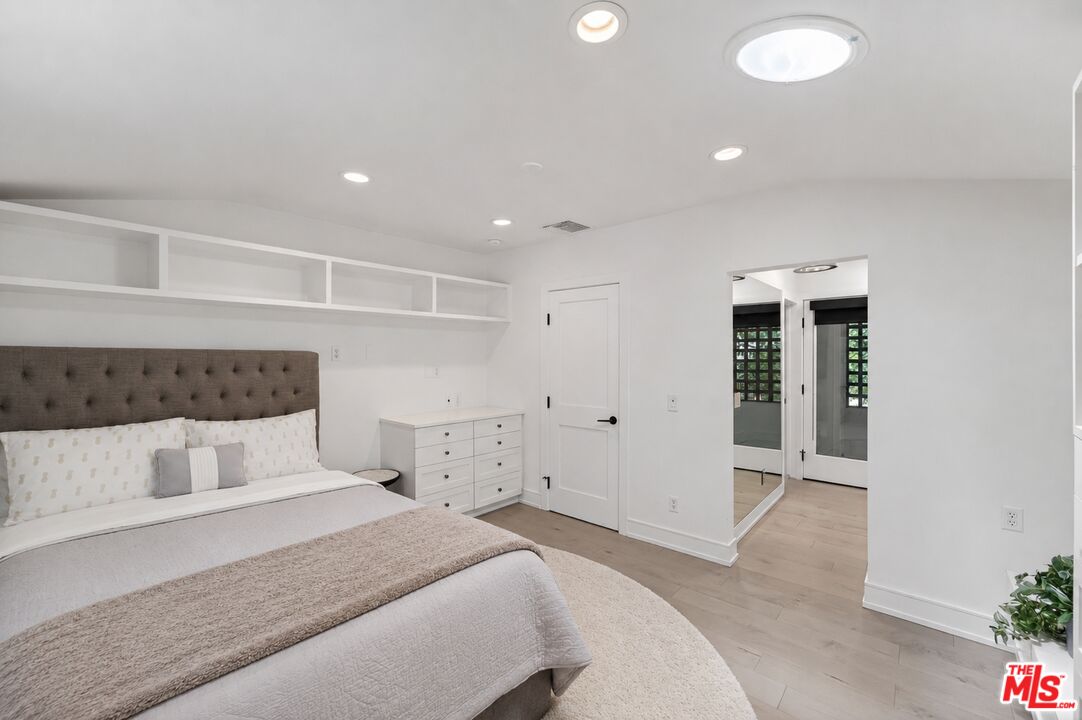 760 South San Rafael Avenue Pasadena, CA 91105 - Photo 38 of 45 a bedroom with a bed and cabinets